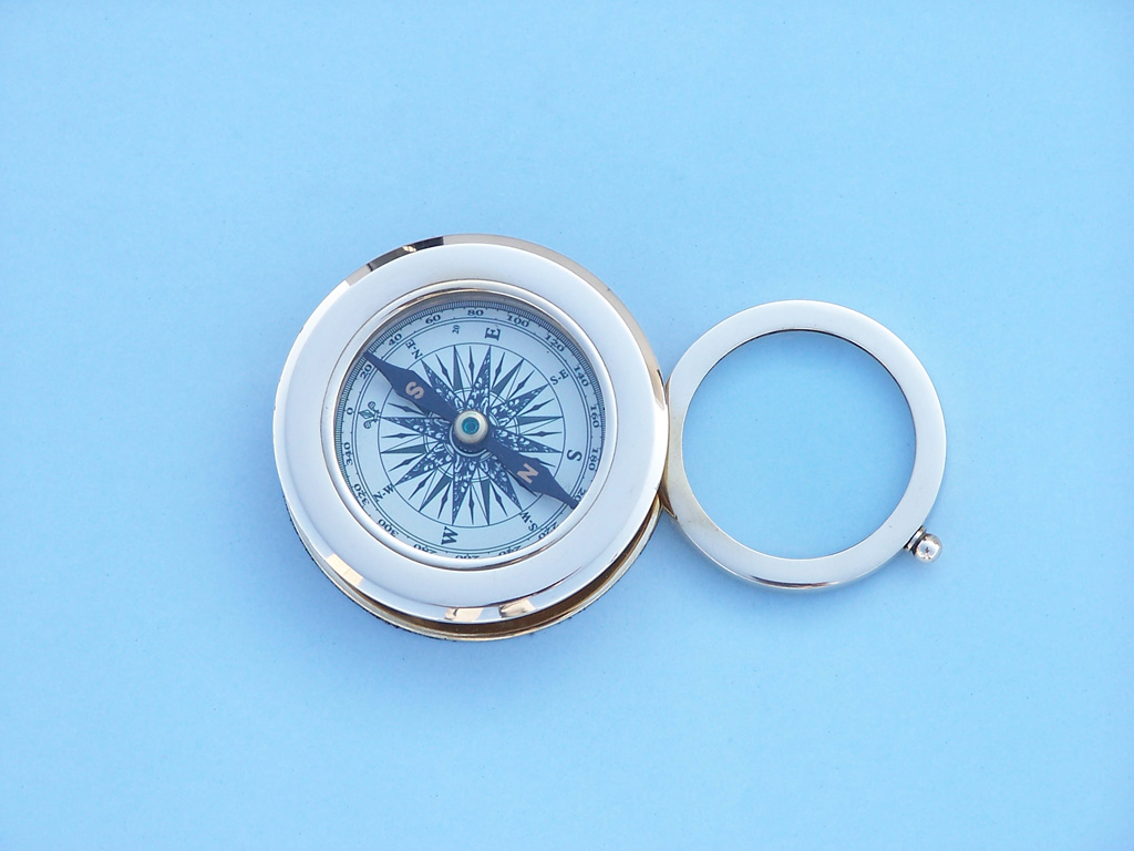 Compass with magnifying glass