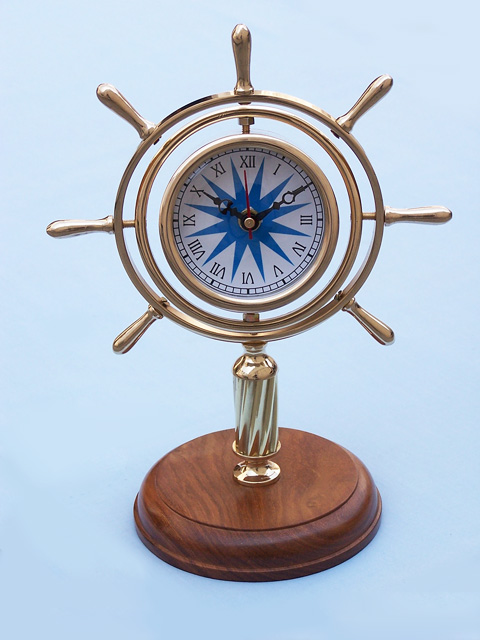 Brass gimballed watch on wood base