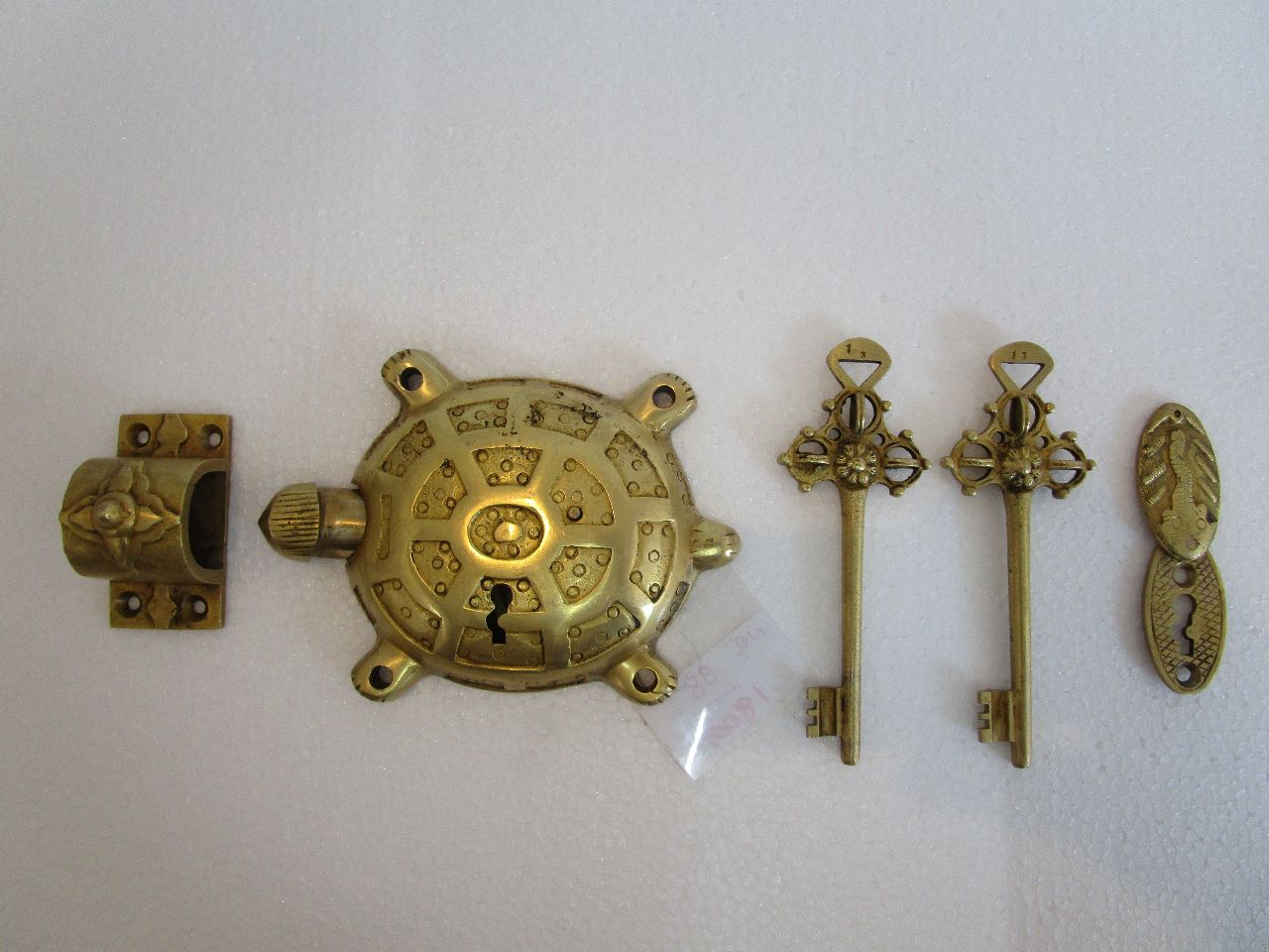 Brass turtle door pad locks